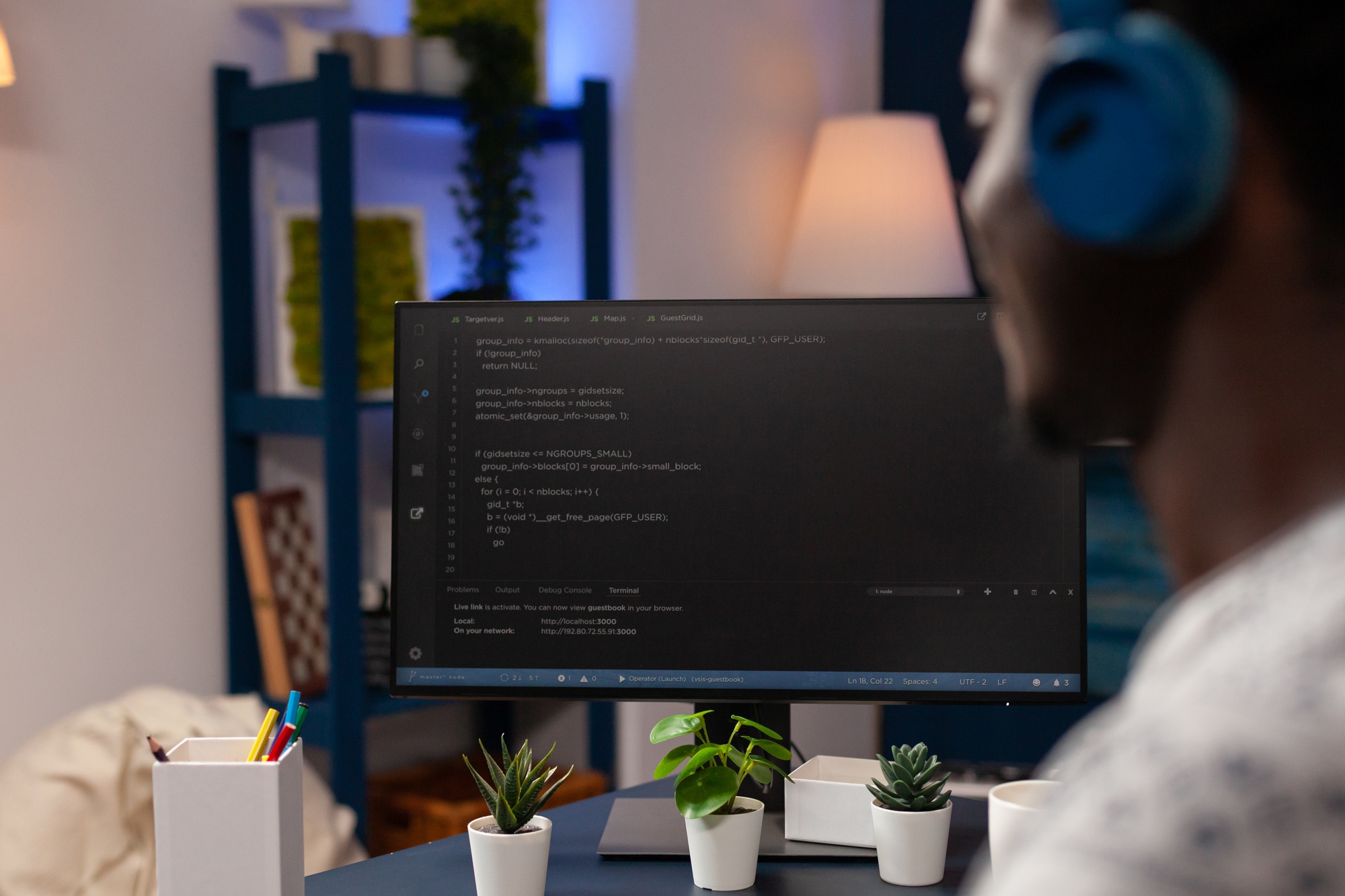 African american young developer programming software for website